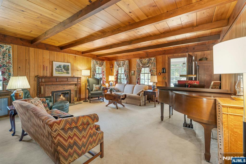 174 Paramus Road Paramus, NJ 07652 - Photo 16 of 45 a living room with furniture and a fireplace