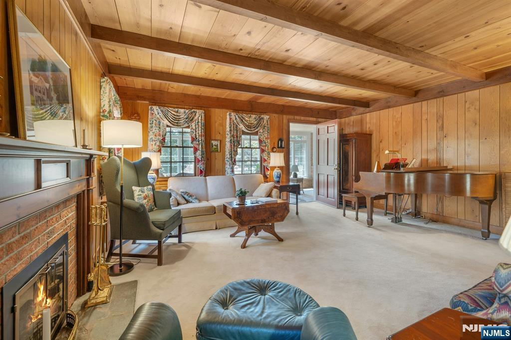 174 Paramus Road Paramus, NJ 07652 - Photo 17 of 45 a living room with furniture and floor to ceiling windows