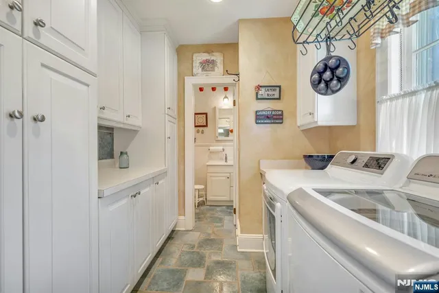 a view of bathroom with dual sinks