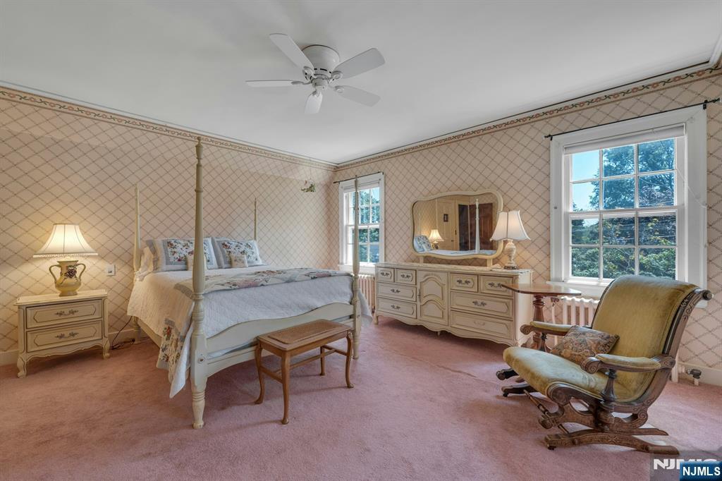 174 Paramus Road Paramus, NJ 07652 - Photo 31 of 45 a bedroom with furniture and a window