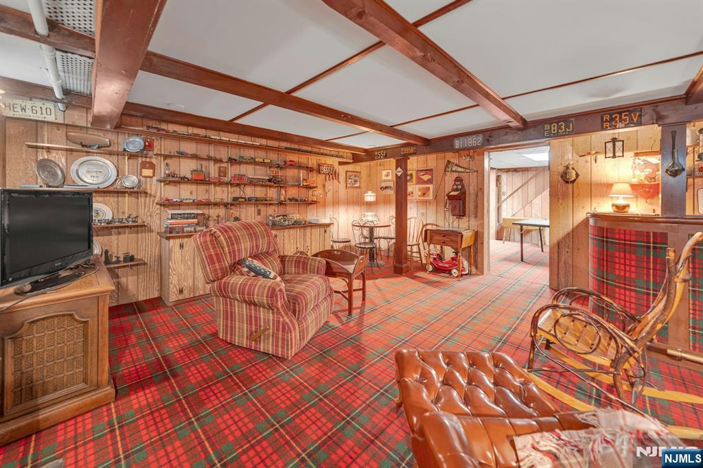 174 Paramus Road Paramus, NJ 07652 - Photo 39 of 45 a view of a livingroom with furniture and a flat screen tv