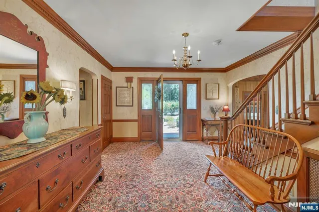 a view of hall way with furniture