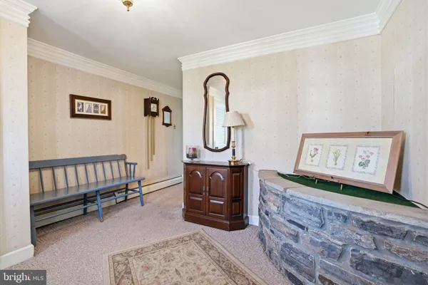 a view of a hallway with entryway wooden floor and front door