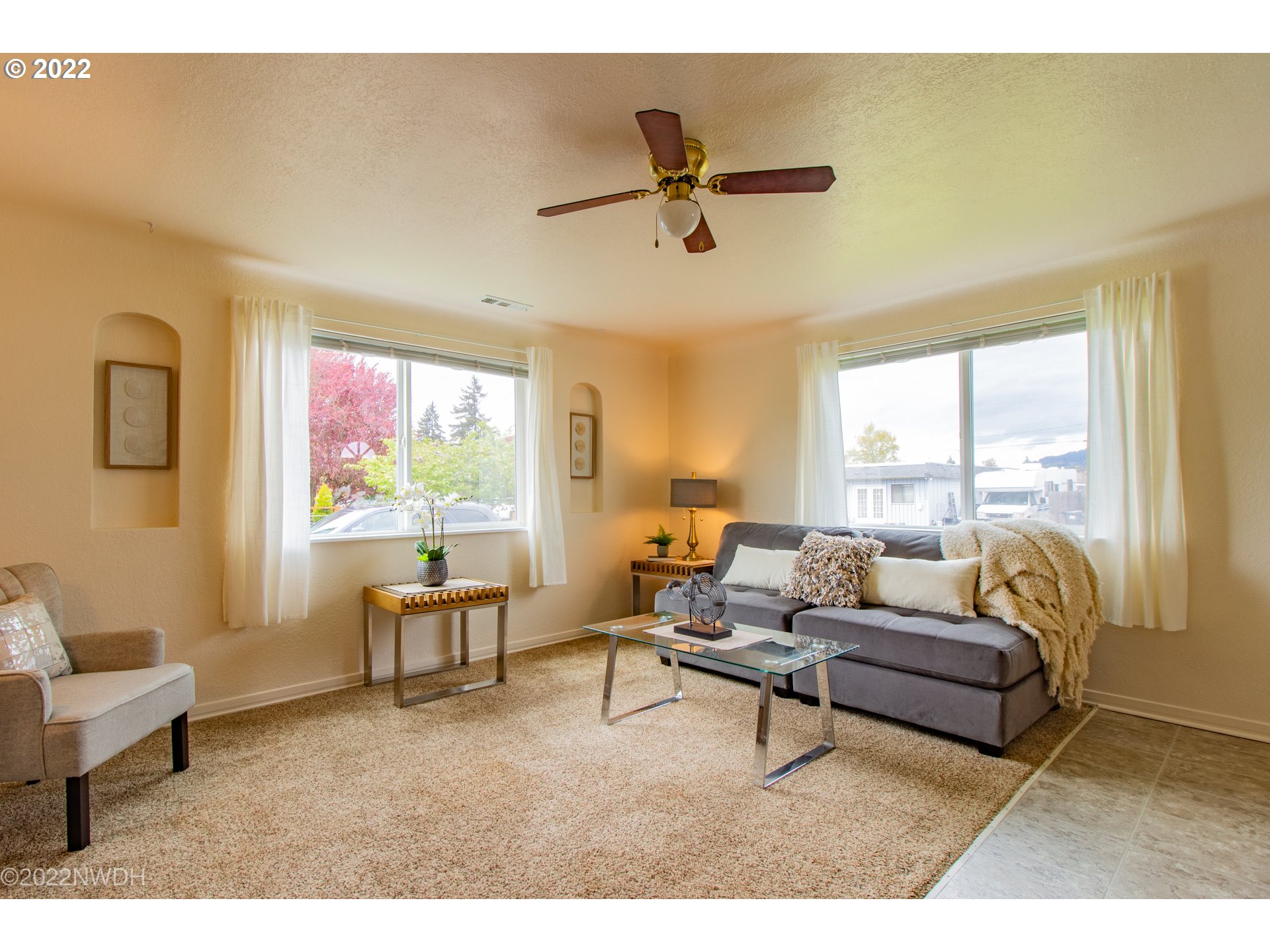 1055 N Street Springfield, OR 97477 - Photo 3 of 23 a living room with furniture and a large window
