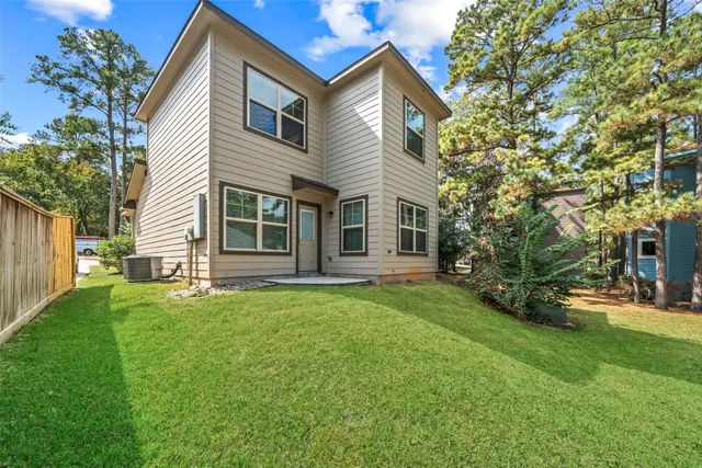 view of a hallway with closet and wooden floor