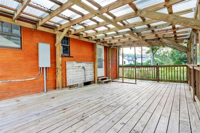 a view of balcony with wooden floor