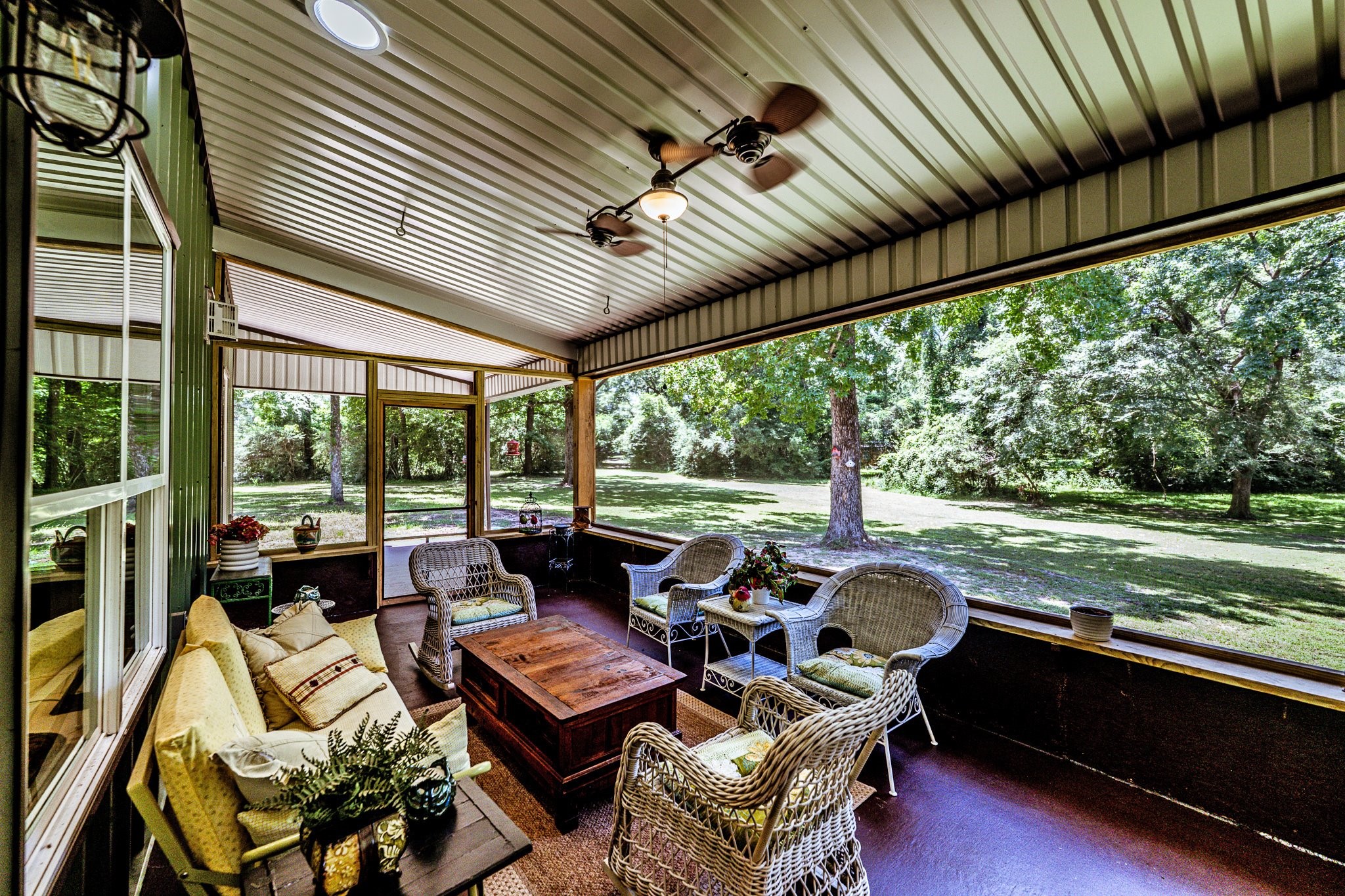 13334 Fultz Road Conroe, TX 77304 - Photo 27 of 49 Sip your morning coffee while watching deer and wildlife wander by—this screened-in porch offers a front-row seat to nature in total comfort.