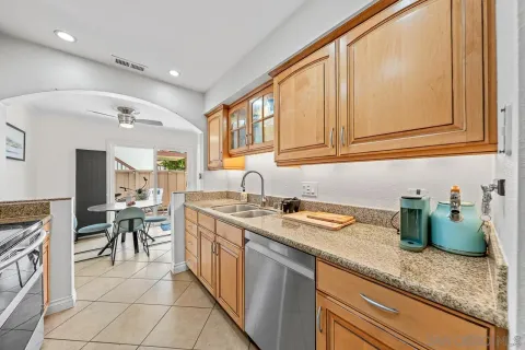 a kitchen with lots of counter space and windows