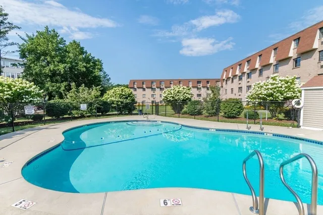 a view of swimming pool with a yard