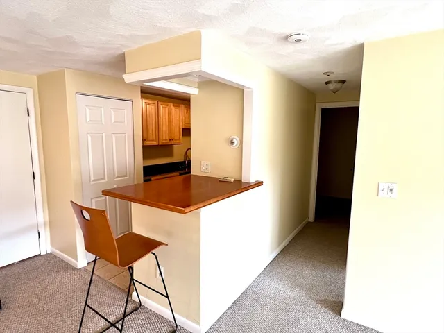 a kitchen with a table and chairs