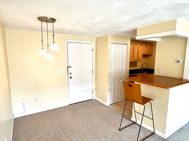 a kitchen with a table and chairs