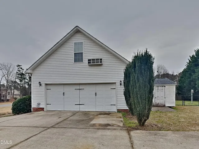 a front view of a house with garage