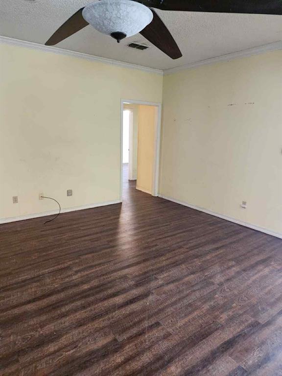 1316 Edna Street Commerce, TX 75428 - Photo 9 of 16 a view of an empty room with wooden floor