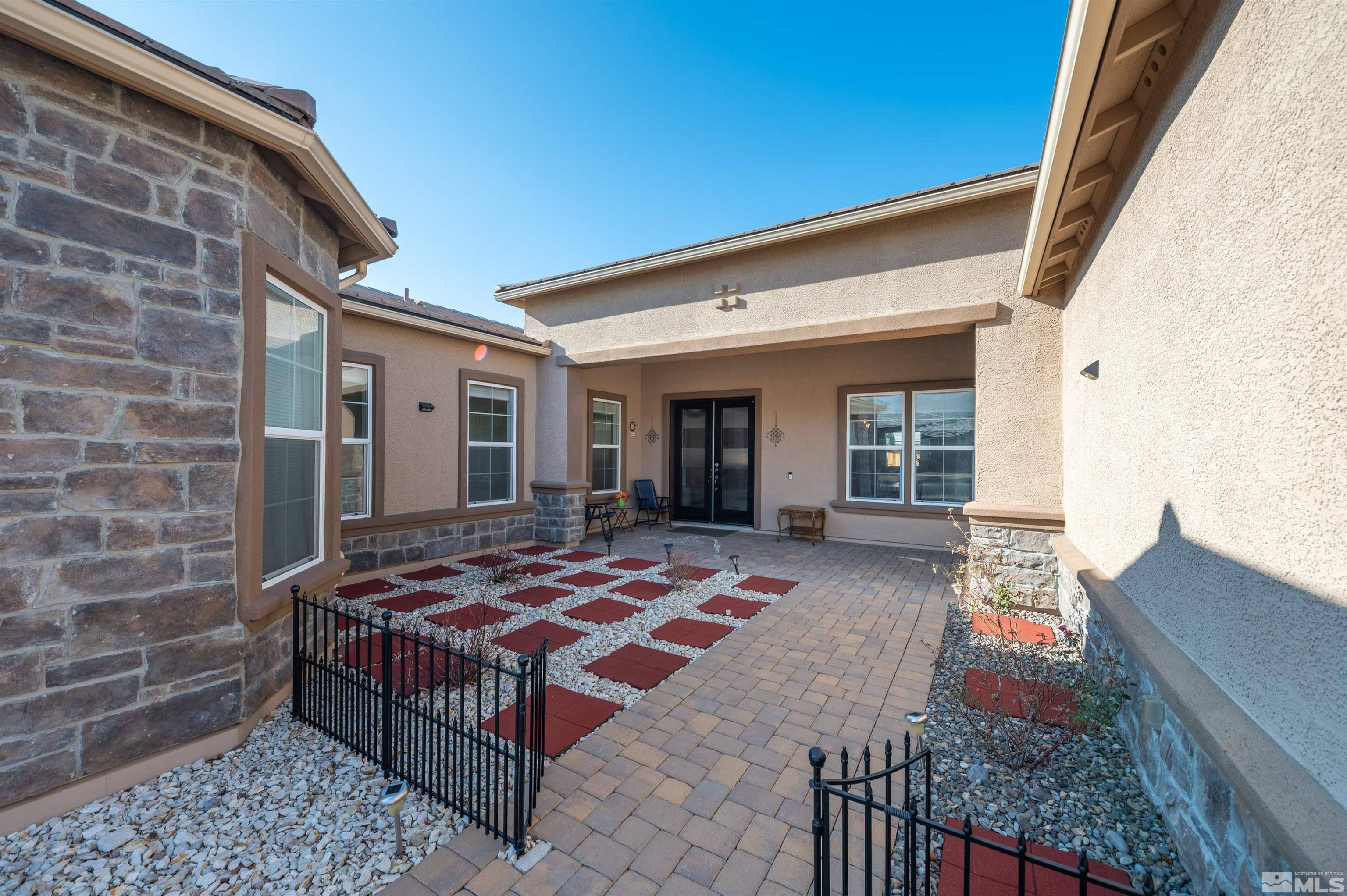 9835 Gainsborough Lane Reno, NV 89521 - Photo 5 of 40 a bedroom with a bed and balcony