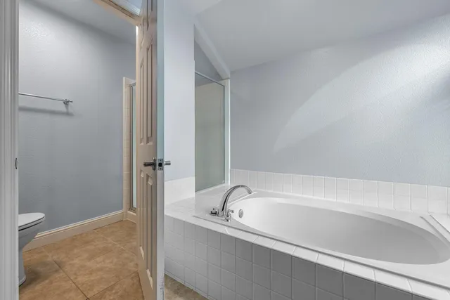 a white bath tub sitting in a bathroom