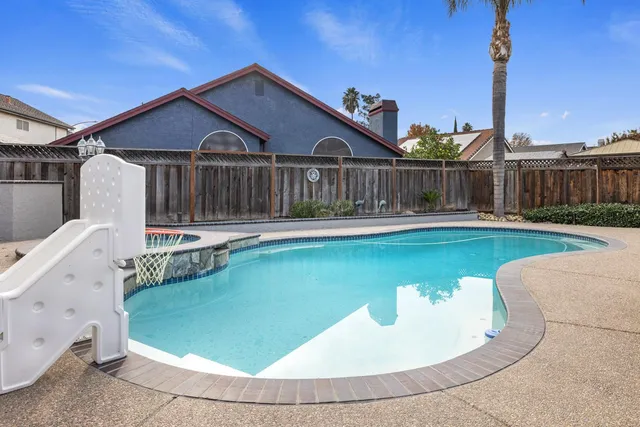 a front view of a house with swimming pool