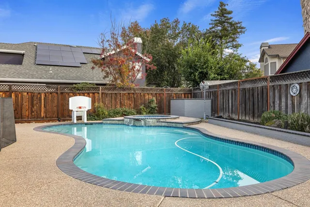 a view of a swimming pool with a lounge chairs