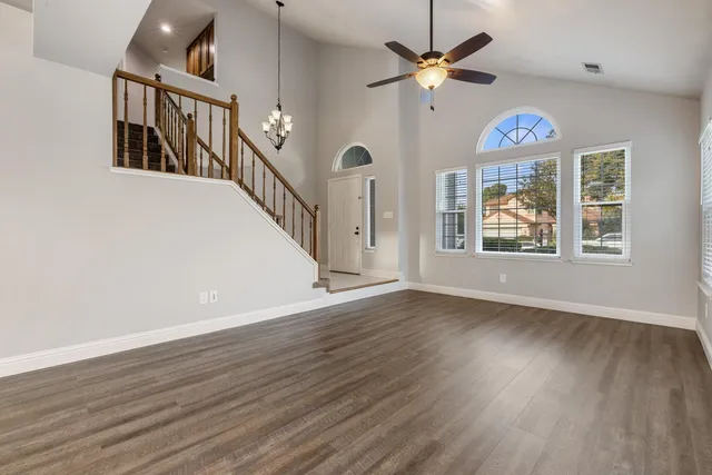 a view of an entryway with wooden floor
