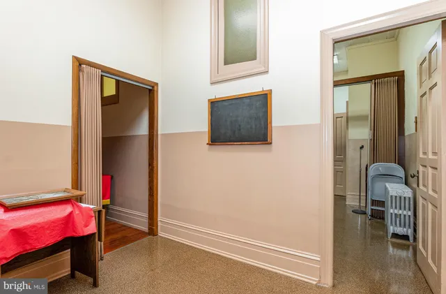 a kitchen with a refrigerator and sink