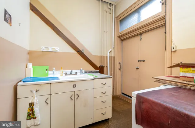 walk in closet with large window and outdoor seating