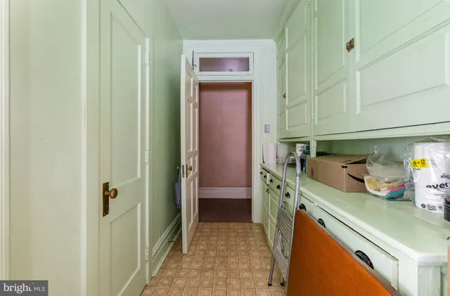 a bedroom with two beds and a couch