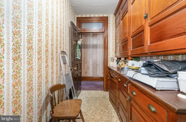 a kitchen with granite countertop lots of counter top space and wooden floor