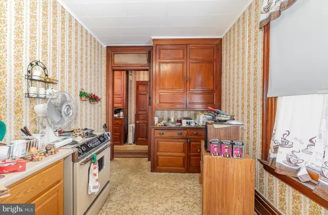 a bedroom with a bed and a chair