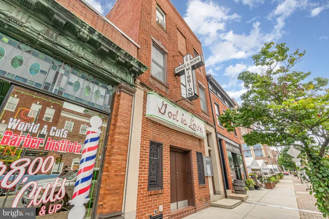 a living room with lots of furniture and a chandelier