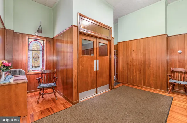 a bedroom with furniture and a window