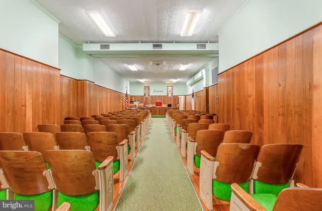 a view of room with furniture and a flat screen tv