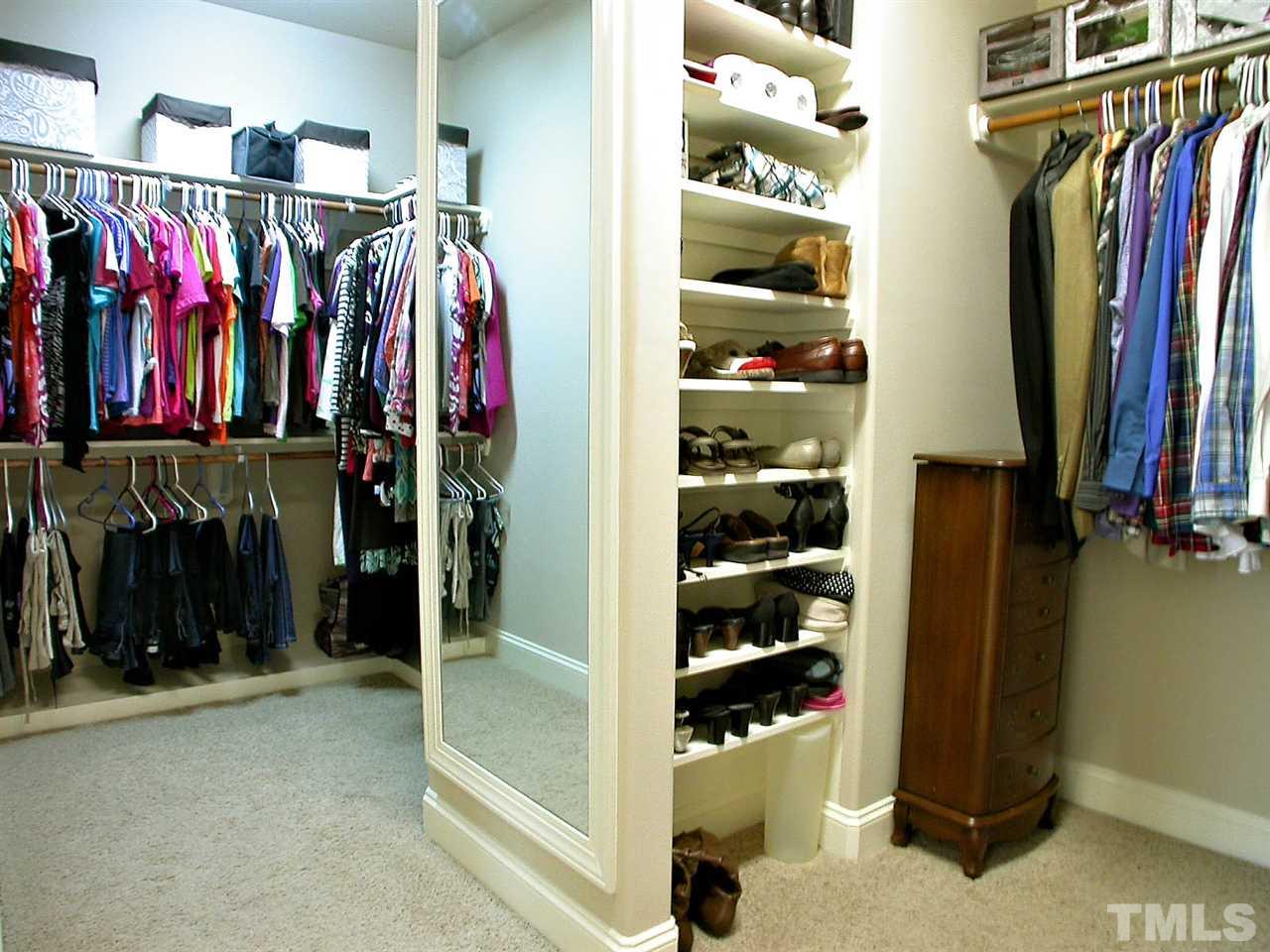 12349 Beestone Lane Raleigh, NC 27614 - Photo 15 of 25 a view of walk in closet with clothes and shoes