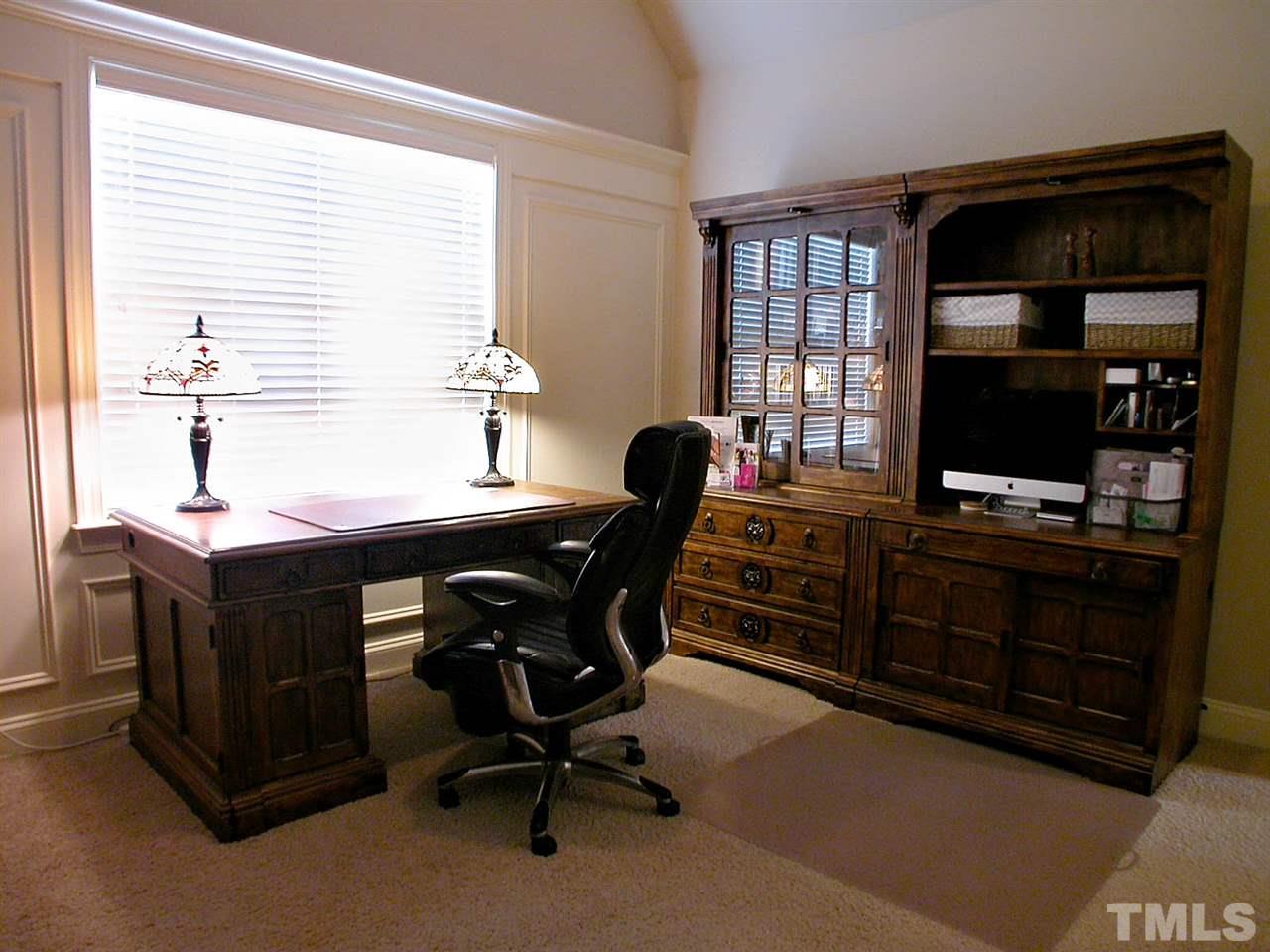 12349 Beestone Lane Raleigh, NC 27614 - Photo 18 of 25 a view of a workspace with furniture and a window