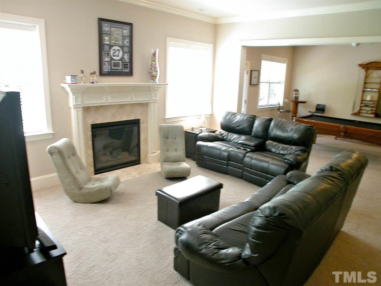 12349 Beestone Lane Raleigh, NC 27614 - Photo 20 of 25 a living room with furniture and a fireplace