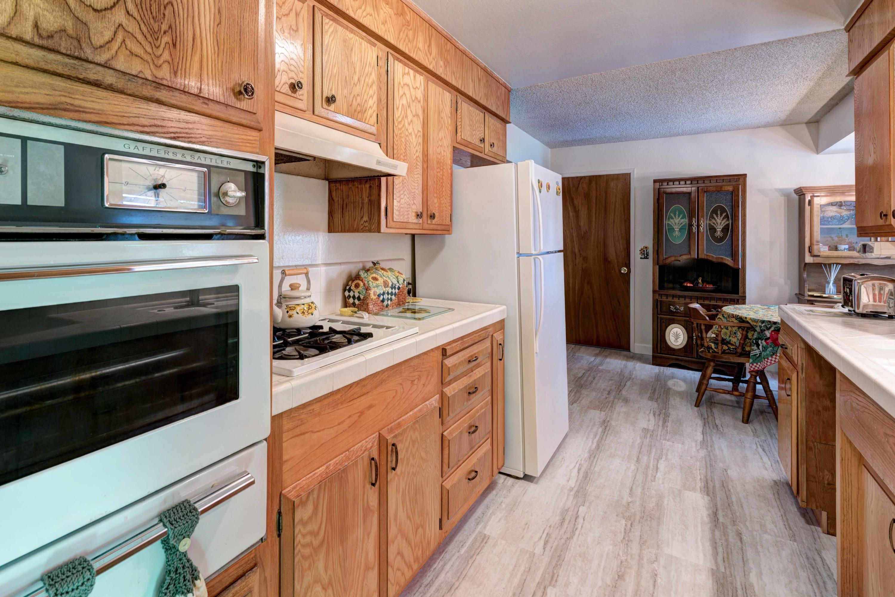 1862 Canyon Road Redding, CA 96001 - Photo 11 of 28 a kitchen with stainless steel appliances a stove microwave and cabinets