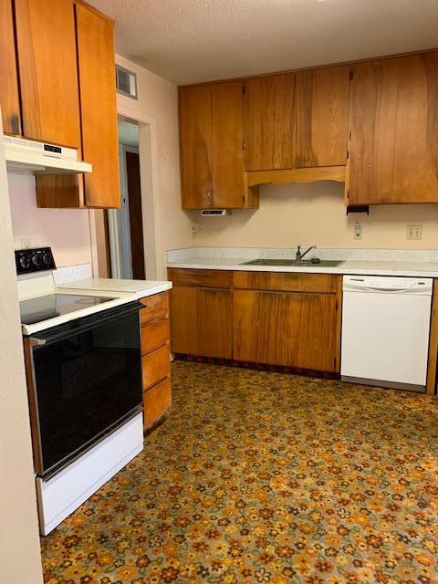 14 9th Street Shalimar, FL 32579 - Photo 5 of 15 a kitchen with stainless steel appliances granite countertop a stove a sink and a microwave