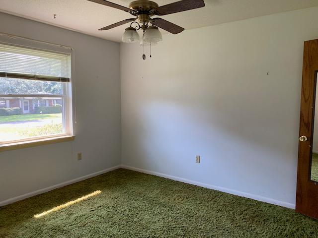 14 9th Street Shalimar, FL 32579 - Photo 9 of 15 an empty room with a window and a fan