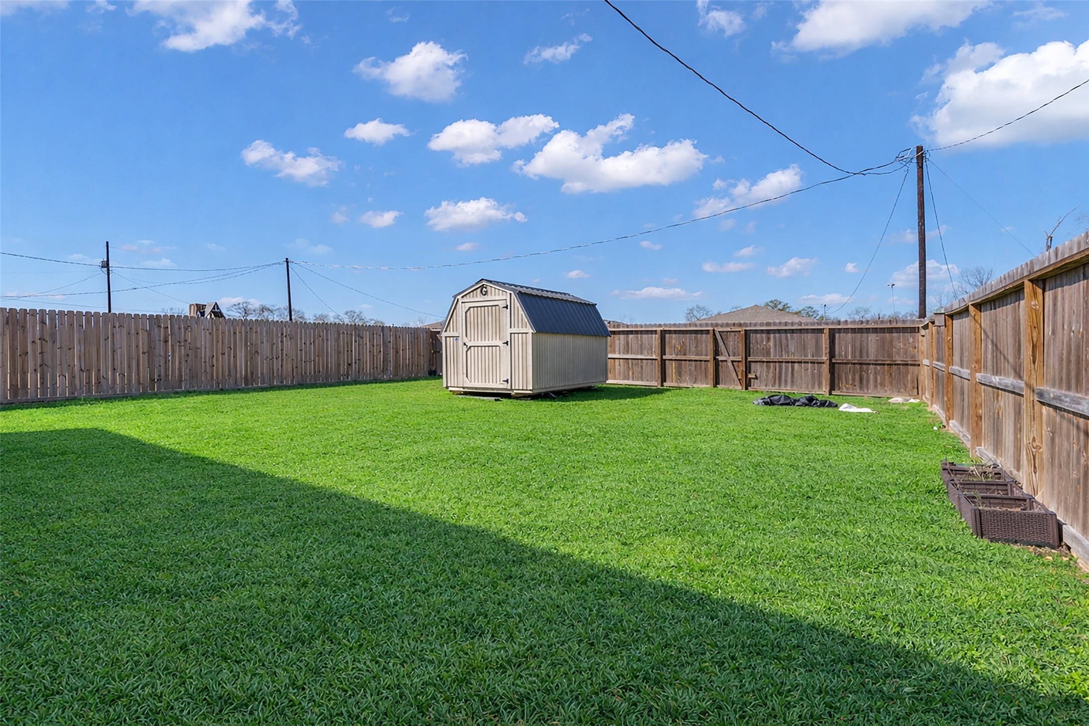 2511 17th Street Hempstead, TX 77445 - Photo 20 of 23 a view of a house with backyard and a cabin