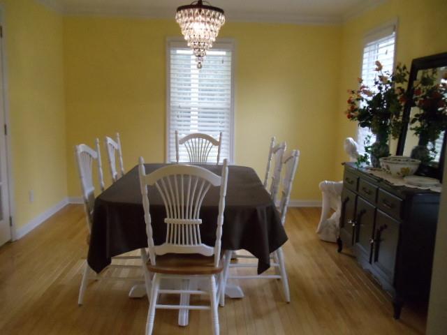 2526 Bodenham Road Pulaski, TN 38478 - Photo 5 of 20 a view of a dining room with furniture and a chandelier