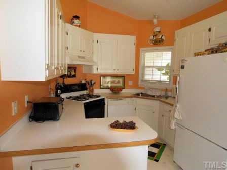 5125 Six Point Trail Raleigh, NC 27616 - Photo 3 of 10 a kitchen with a refrigerator and a stove top oven