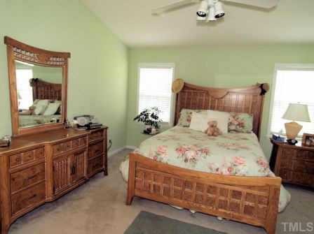 5125 Six Point Trail Raleigh, NC 27616 - Photo 4 of 10 a bedroom with a bed and wooden floor