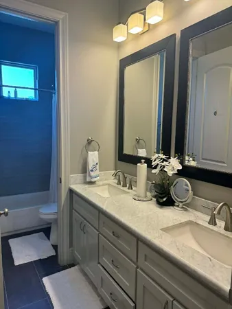 a bedroom with a bed and a night stand