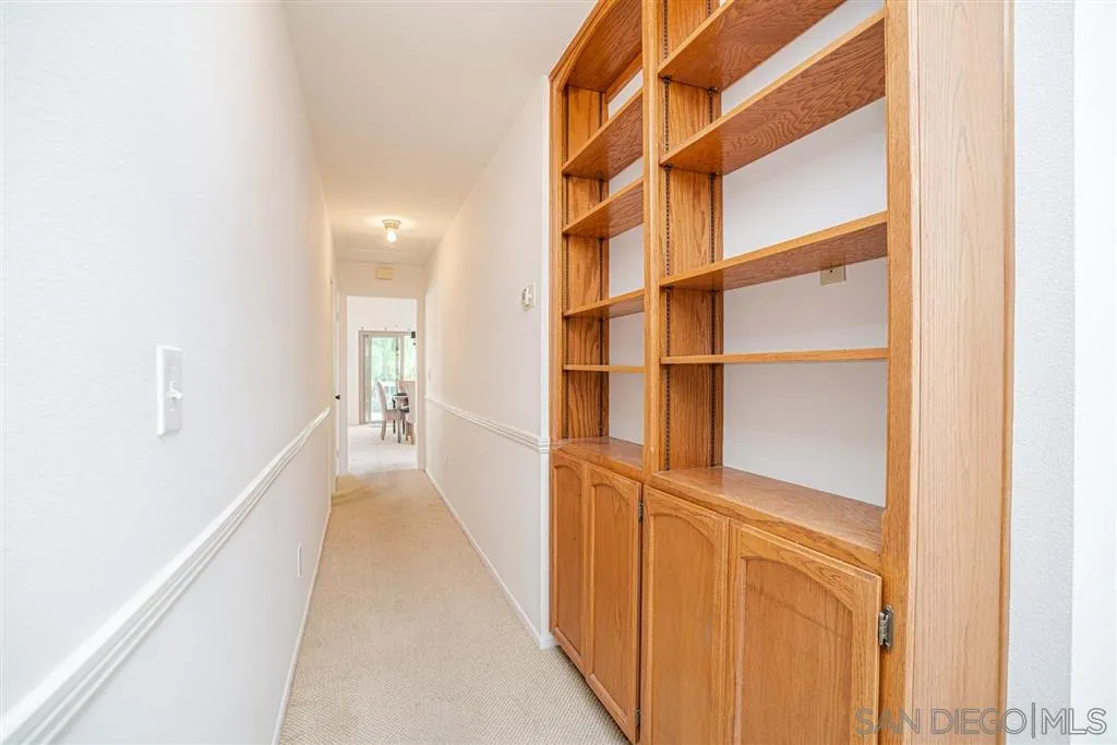 8549 Circle R Valley Lane Escondido, CA 92026 - Photo 17 of 25 a view of a hallway with wooden floor and entryway