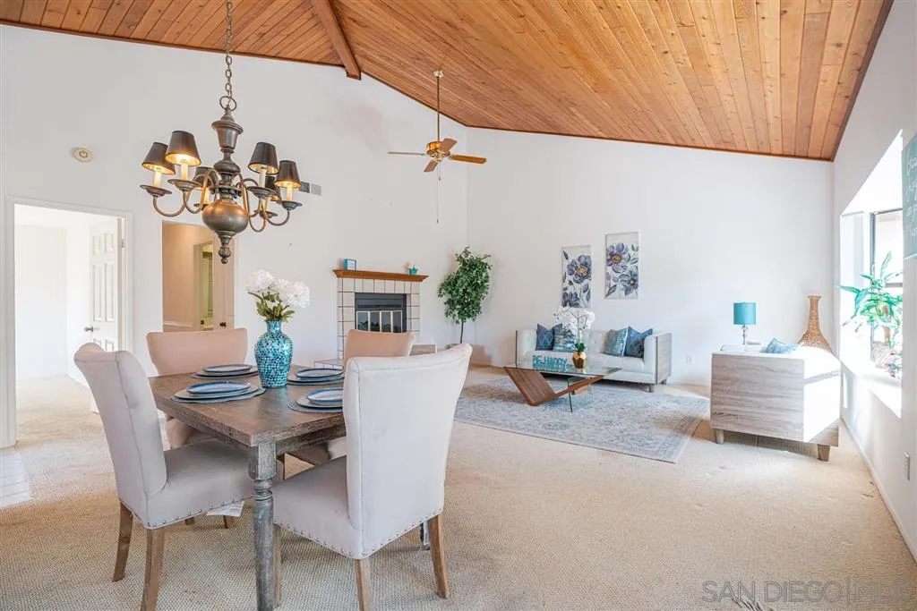 8549 Circle R Valley Lane Escondido, CA 92026 - Photo 23 of 25 a view of a dining room with furniture and a chandelier