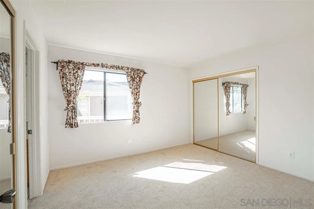 8549 Circle R Valley Lane Escondido, CA 92026 - Photo 10 of 25 an empty room with windows