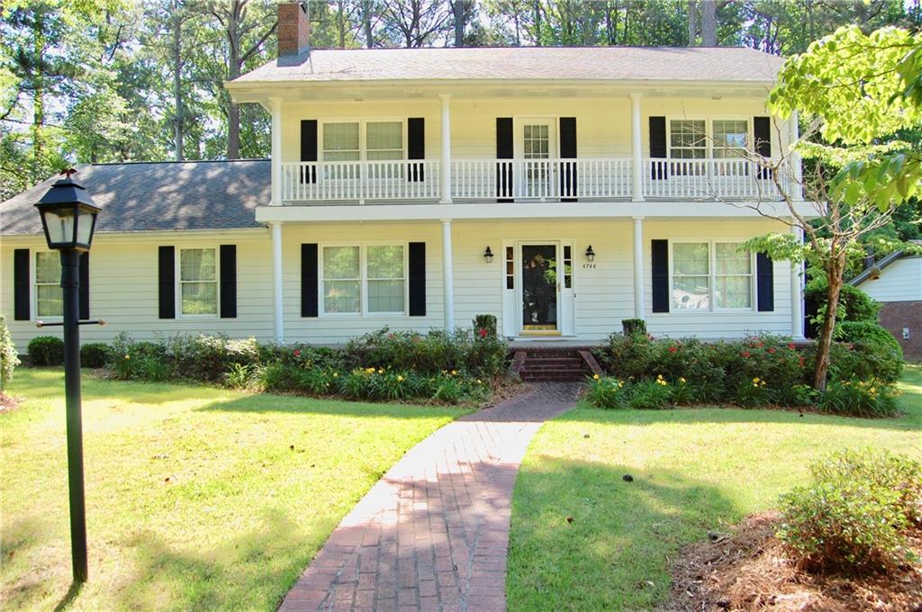 Upper balcony running full length of house. Gorgeous home on cue-de-sac street. Super quiet. Entire lot is level and usable and easy to maintain. Gas lamp out front.