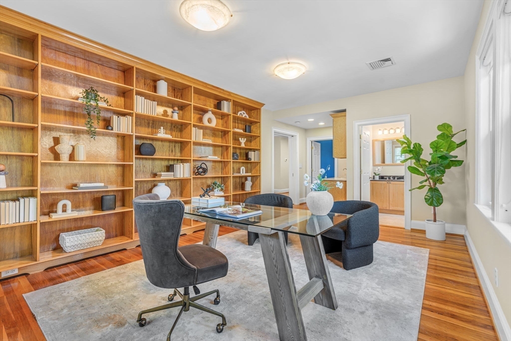 27 Newell Road, Unit 2 Brookline, MA 02446 - Photo 14 of 41 a workspace with furniture and a potted plant