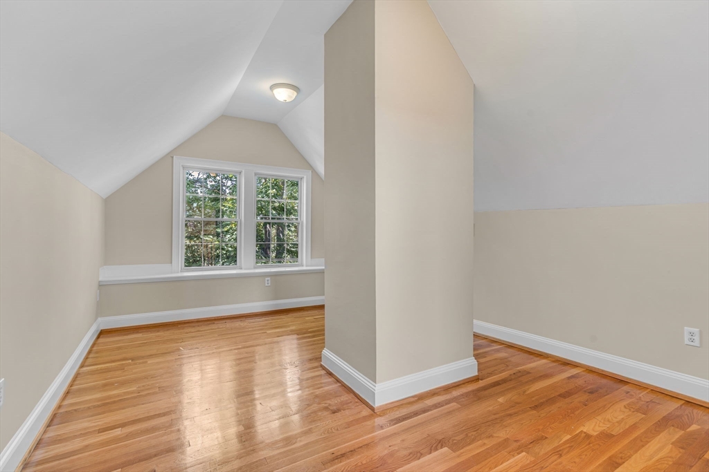 27 Newell Road, Unit 2 Brookline, MA 02446 - Photo 23 of 41 an empty room with wooden floor and windows