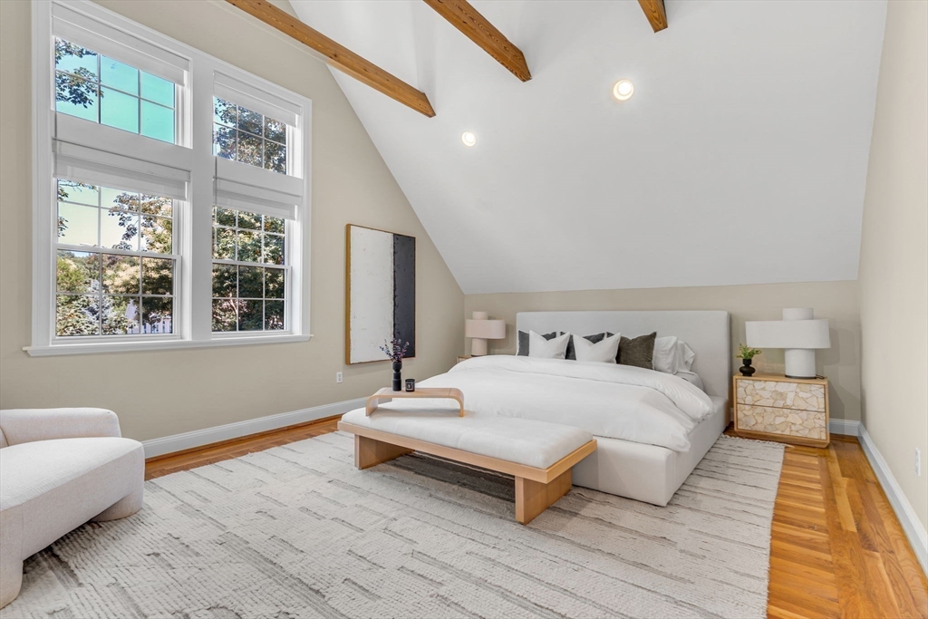 27 Newell Road, Unit 2 Brookline, MA 02446 - Photo 24 of 41 a spacious bedroom with a bed and a large window