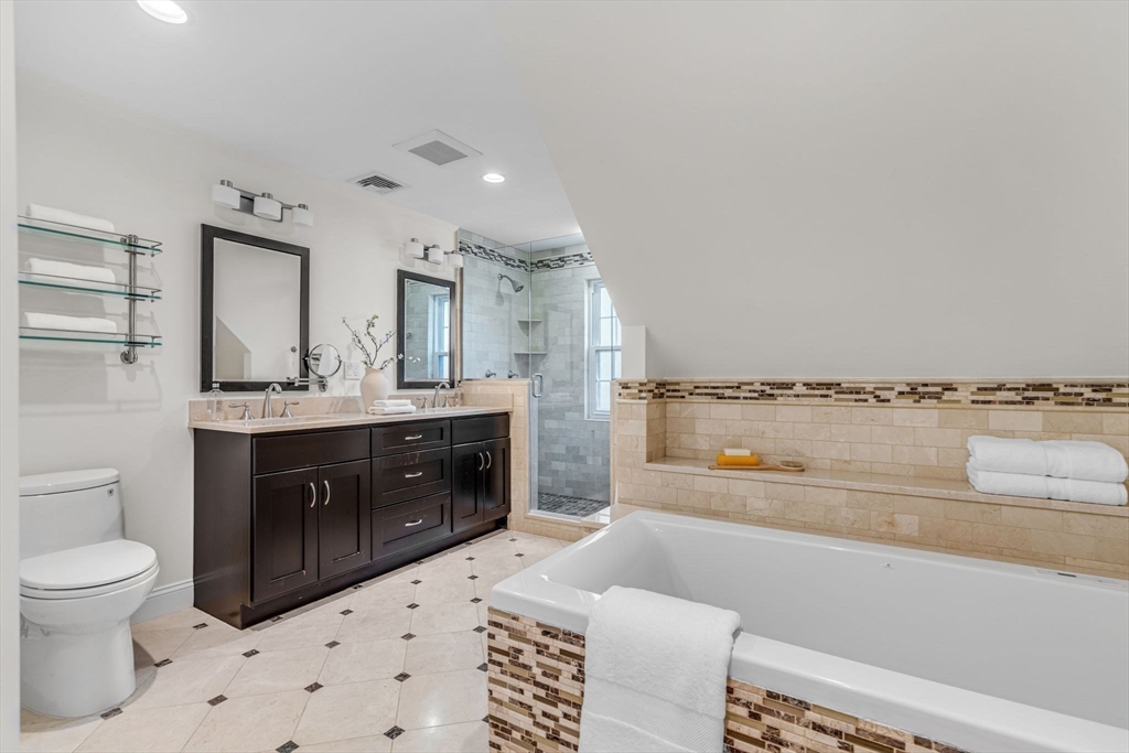 27 Newell Road, Unit 2 Brookline, MA 02446 - Photo 27 of 41 a bathroom with a sink a toilet and vanity