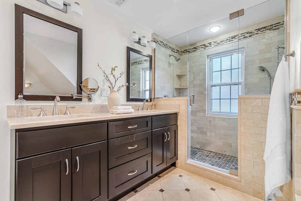 27 Newell Road, Unit 2 Brookline, MA 02446 - Photo 29 of 41 a bathroom with a double vanity sink mirror and double